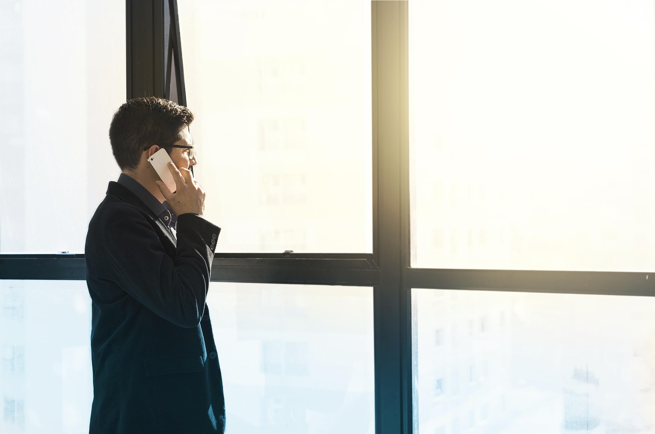Man, cell phone, tuxedo — Charles Principato: Driving Innovation in Financial Solutions and Capital Funding