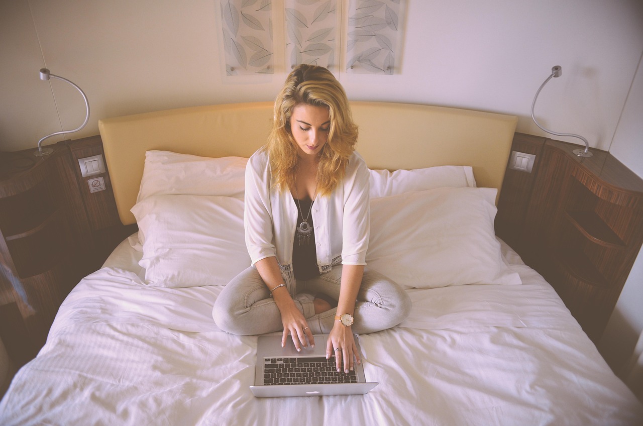 Woman, working, bed — Steering Your Legacy: The Impact of Restricted Property Trusts