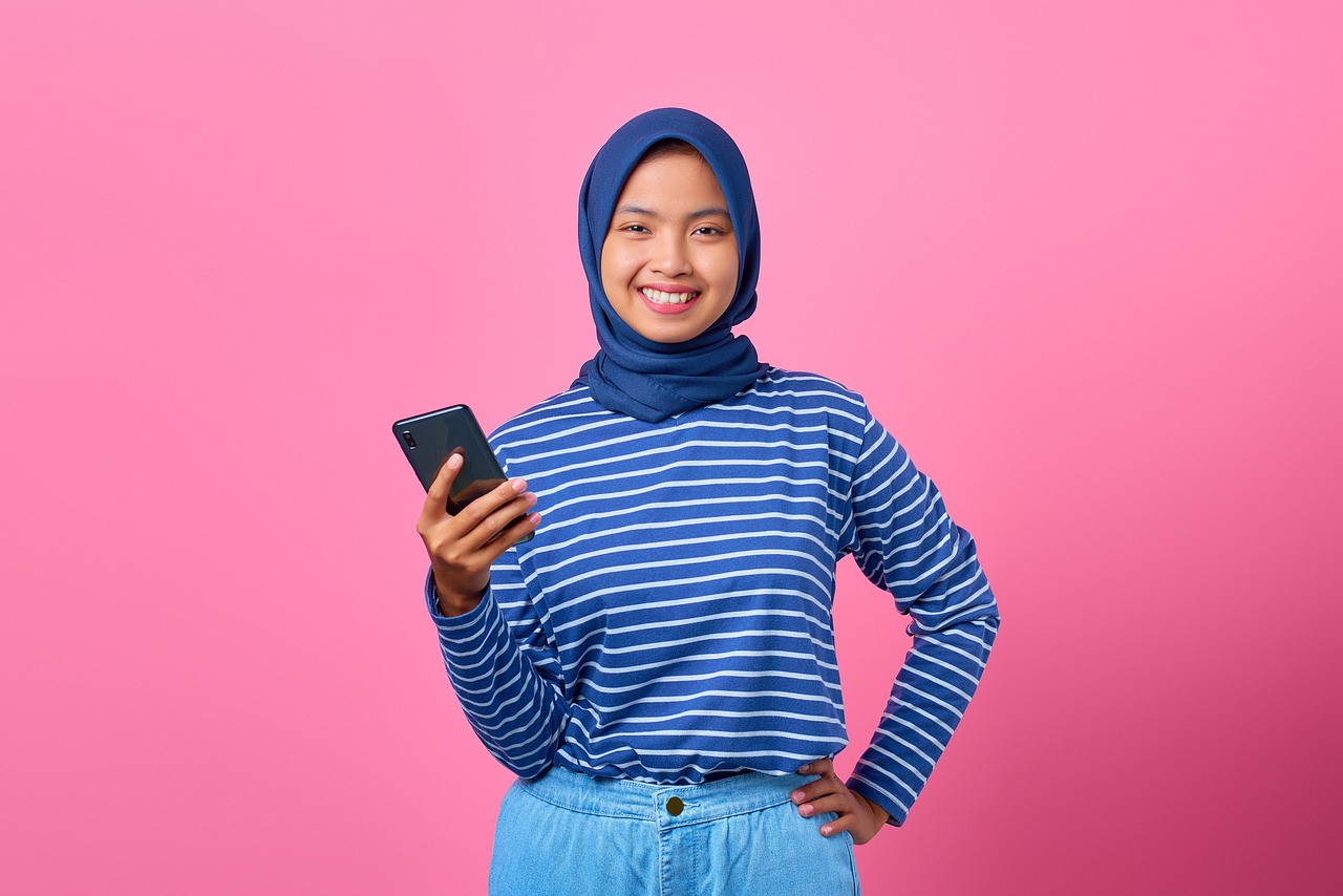 Girl, smartphone, happy — Your Guide to Safe Playground Toto Site Gambling
